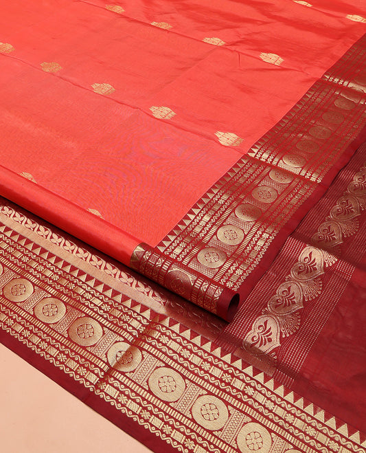 Orange Venkatagiri Silk Saree, Enthralled with Zari Buttas on Its Body, Complemented by a Contrast Traditional Zari Design Border, Pallu Depicts Floral and Zig-Zag Strip Designs, and Paired with a Contrast Blouse