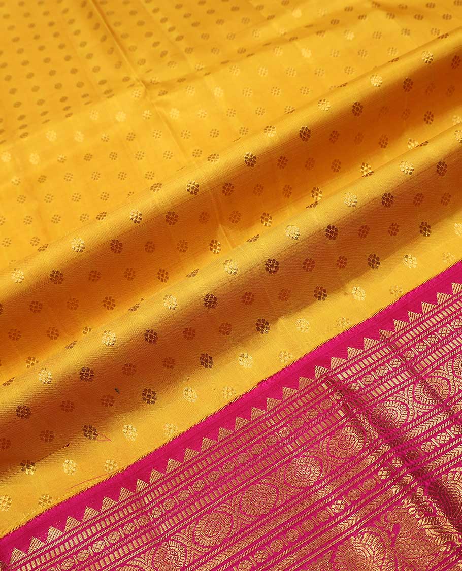 Yellow pure silk half saree, kamalam buttas skirt, contrast border, and blouse of rekku,muthu,kathir,chakram,mayil and kuyil kann, and zari checked dhavani