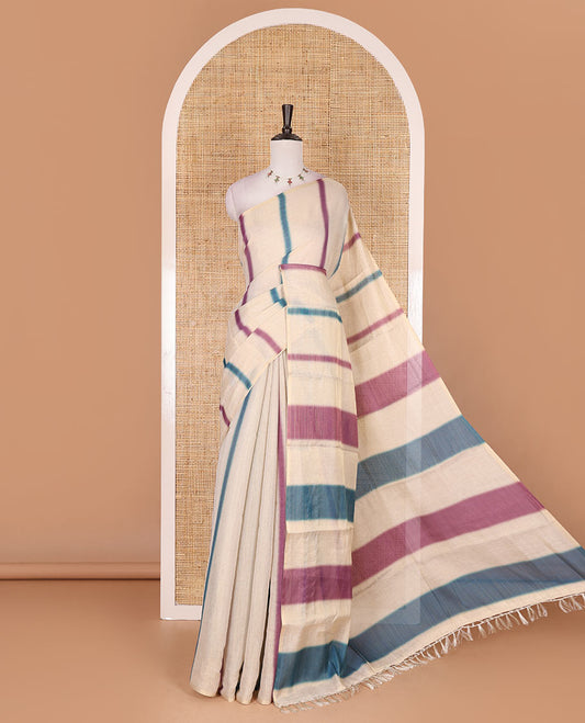 Borderless cream, colorful striped tissue saree, unique motifs printed blue color blouse