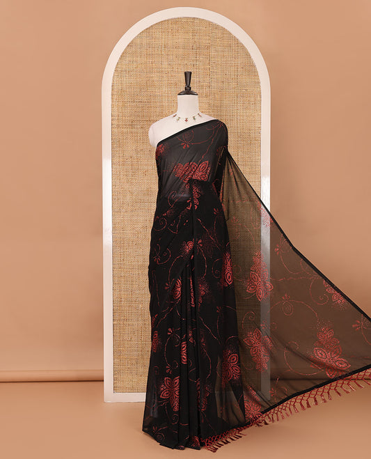 Borderless black 60 gm georgette saree features floral vine designs green glitter embroidery work, contrast plain blouse