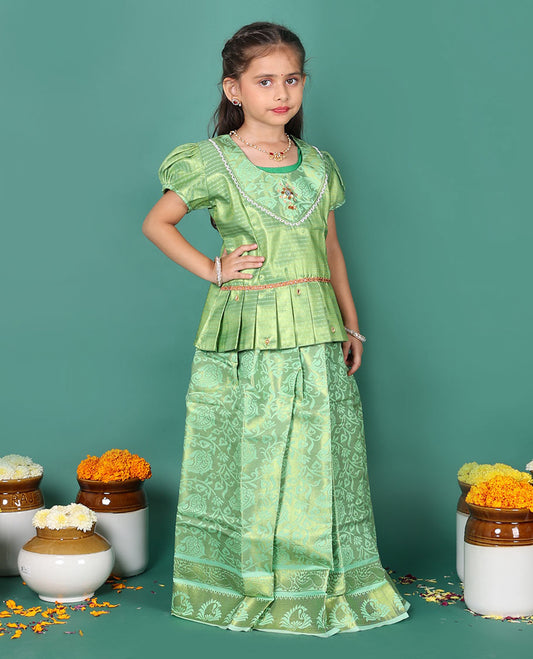 Green readymade art silk pavadai set, floral jaal jacquard with traditional zari border skirt, jacquard embroidered puff-sleeve blouse