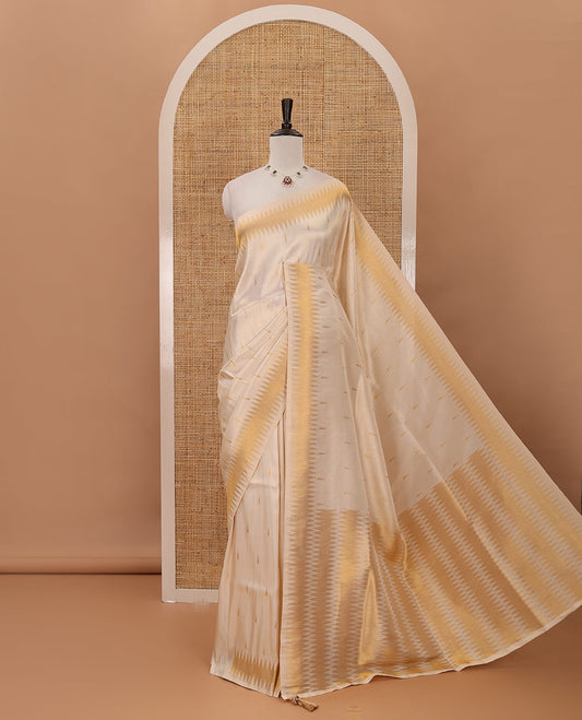 Cream thilakam motifs banarasi tissue saree, zig-zag gold zari border, zig-zag zari design pallu & running blouse