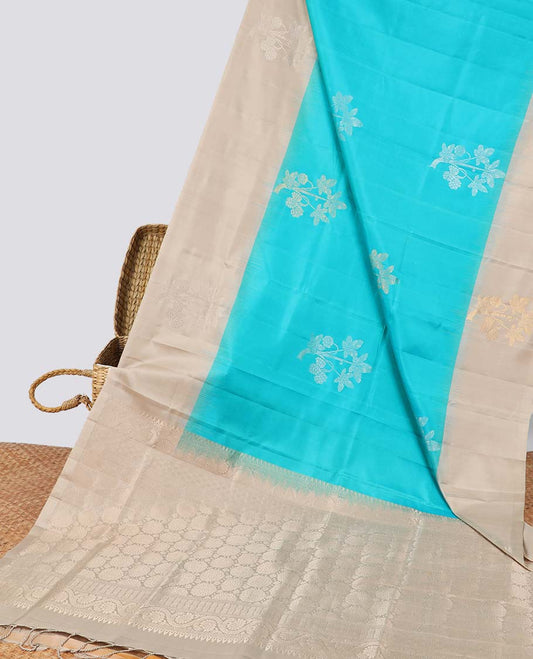 Blue floral buttas soft silk saree with contrast zari design border & round buttas pallu