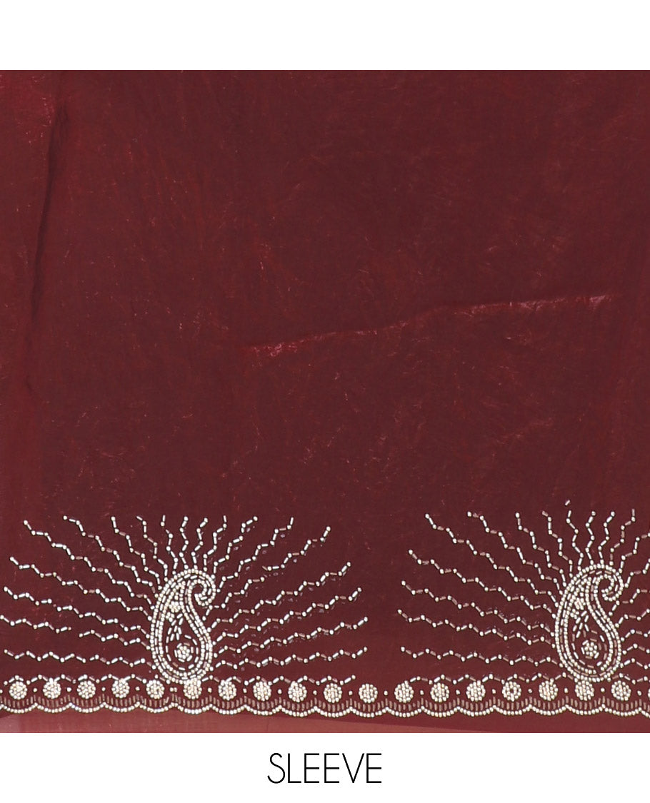 Maroon micro-stone work fendy chiffon saree with paisley stone work on its shoulder, a scallop stone work border, a butterfly style pallu, and a matching stone work blouse