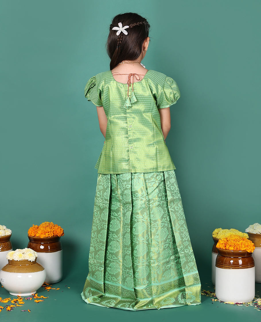 Green readymade art silk pavadai set, floral jaal jacquard with traditional zari border skirt, jacquard embroidered puff-sleeve blouse