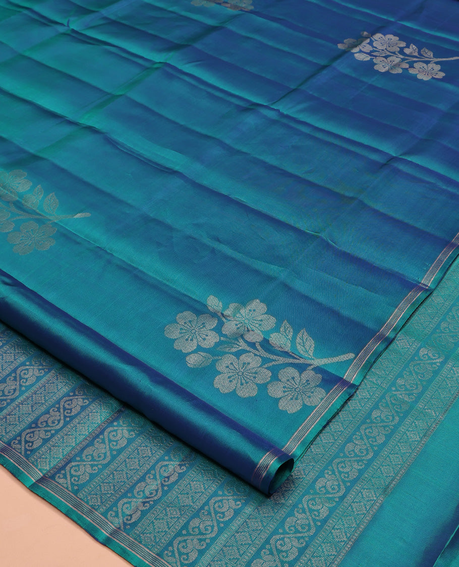 Borderless Blue Mayuri Lite Silk Mix Saree, Subtly Accented with Floral Zari Buttas All Over Its Body, Highlighted by a Pallu of Geometric Designs, and Paired with a Matching Blouse