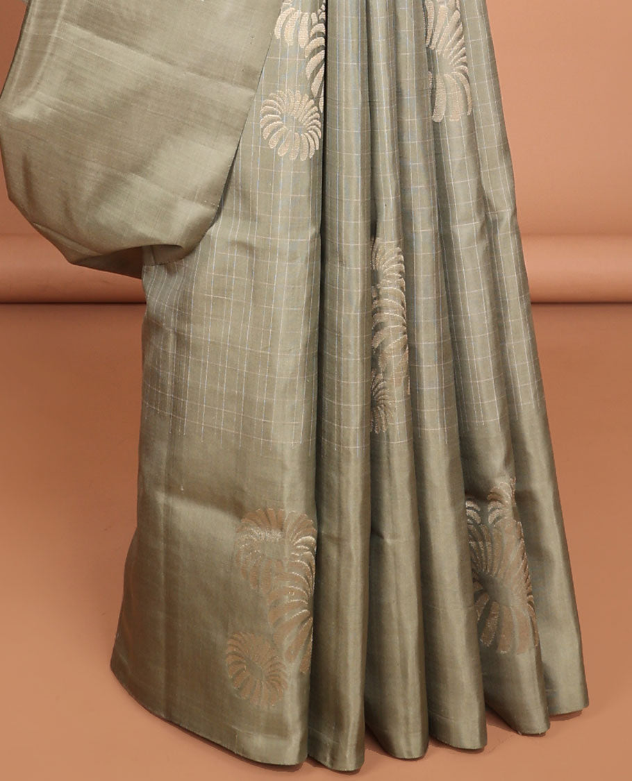 Borderless green buttas soft silk saree with intricate zari design pallu