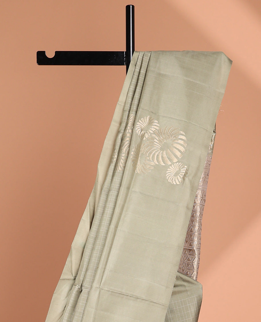 Borderless green buttas soft silk saree with intricate zari design pallu