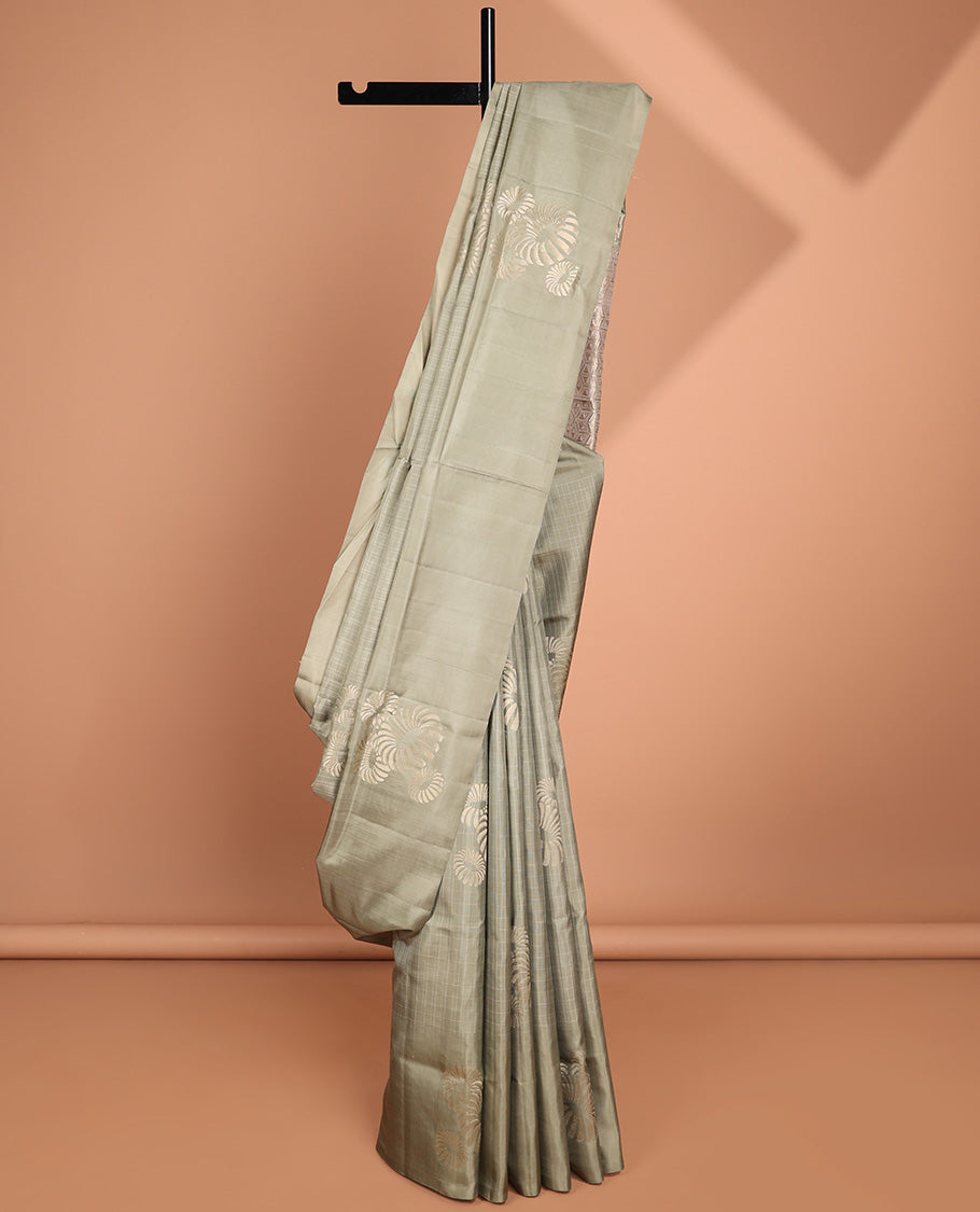Borderless green buttas soft silk saree with intricate zari design pallu
