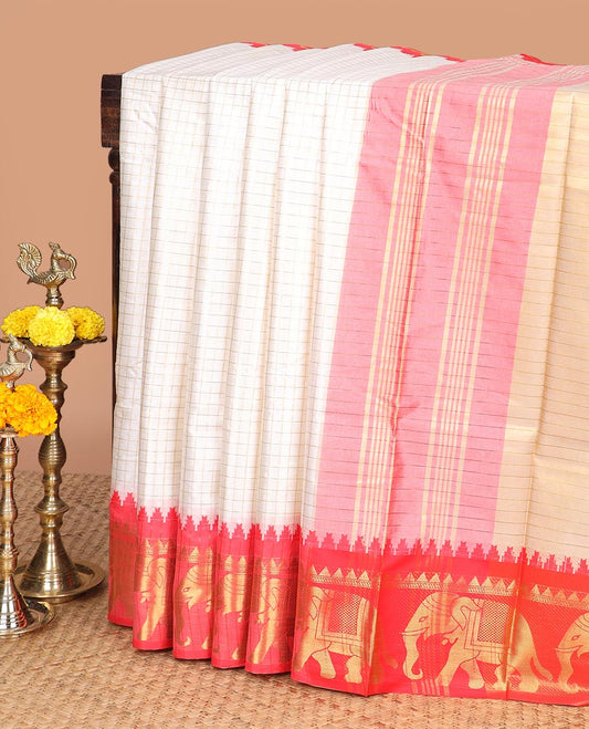 Cream zari checked design dola silk saree with contrast elephant design border & chit pallu along with checked design blouse