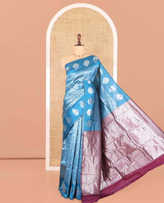 Blue Art Kanchi Silk Saree Features Jacquard Design, a Zari-Motif Border, Contrast Intricate Pallu, and a Contrast Blouse