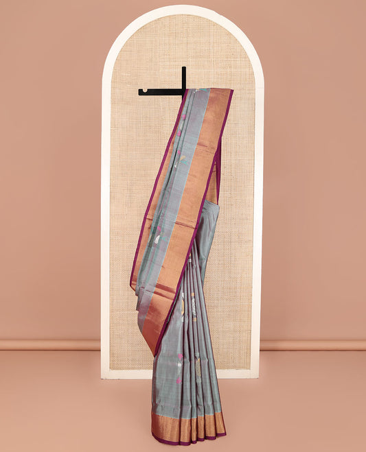 Grey Uppada Silk Saree, Elevated with Meena Buttas All Over Its Body, Complemented by Contrast Zari Bavanji Border, Captivating Contrast Pallu Steeped with Meena Buttas, and Paired with a Contrast Blouse