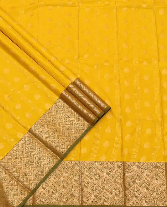 Yellow Art Silk Pavadai Material Set Sparsely Woven with Buttas and Stripes on Its Skirt, Complemented by a Contrast Jaal Zari Design Border, and Paired with a Contrast Blouse