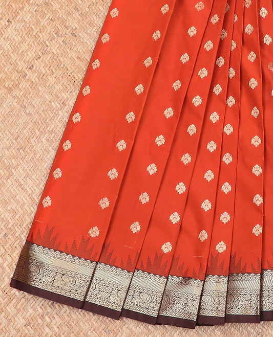 Orange buttas budget silk saree, contrast temple traditional border of peacock designs, and jaal pallu