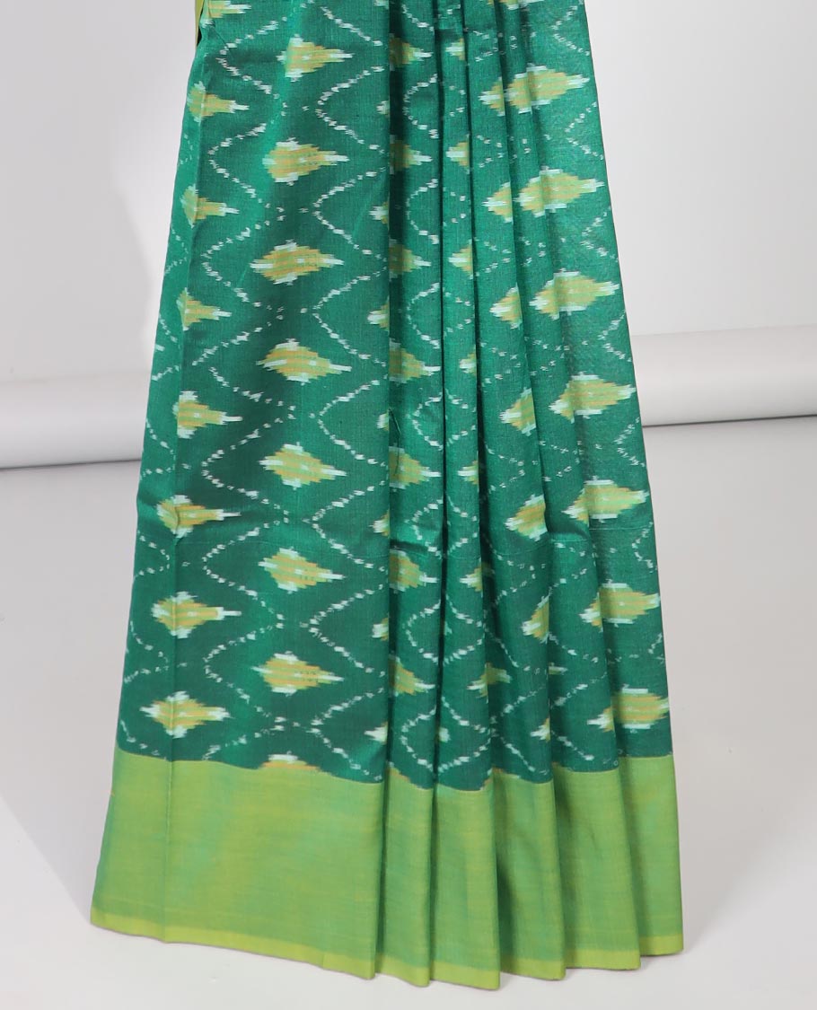 Green argyle design ikkat cotton with contast plain border & intricate butta design pallu