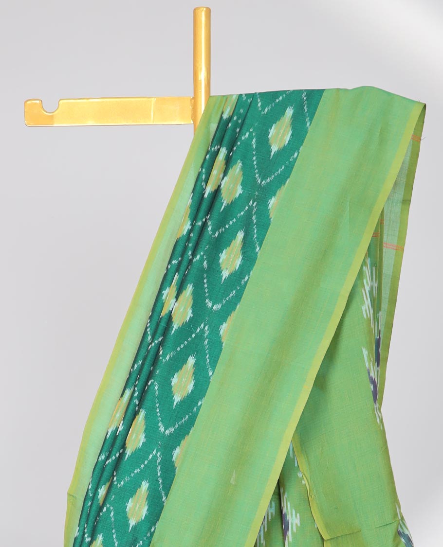 Green argyle design ikkat cotton with contast plain border & intricate butta design pallu