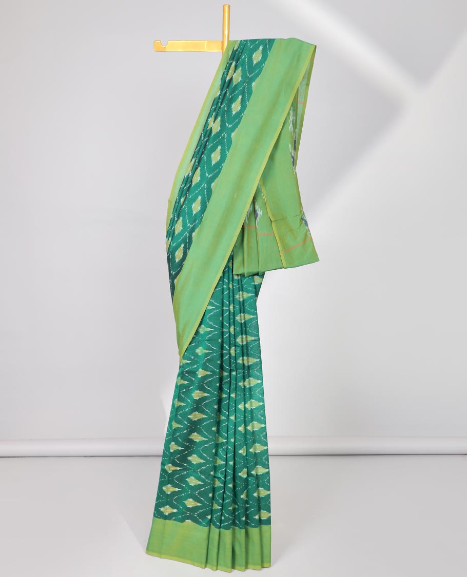 Green argyle design ikkat cotton with contast plain border & intricate butta design pallu