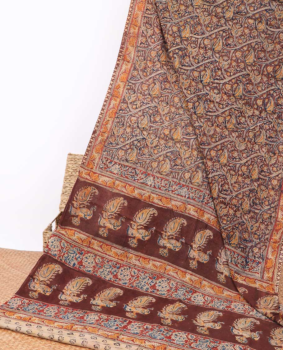 Brown floral design kalamkari cotton saree with contrast floral border & intricate floral design pallu