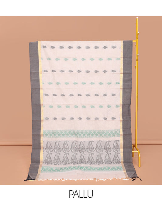 Off-White Kanchi Cotton Saree, Decked Up with Buttas All Over Its Body, Complemented by a Contrast Border, Pallu of Paisley Designs, and Paired with a Matching Blouse