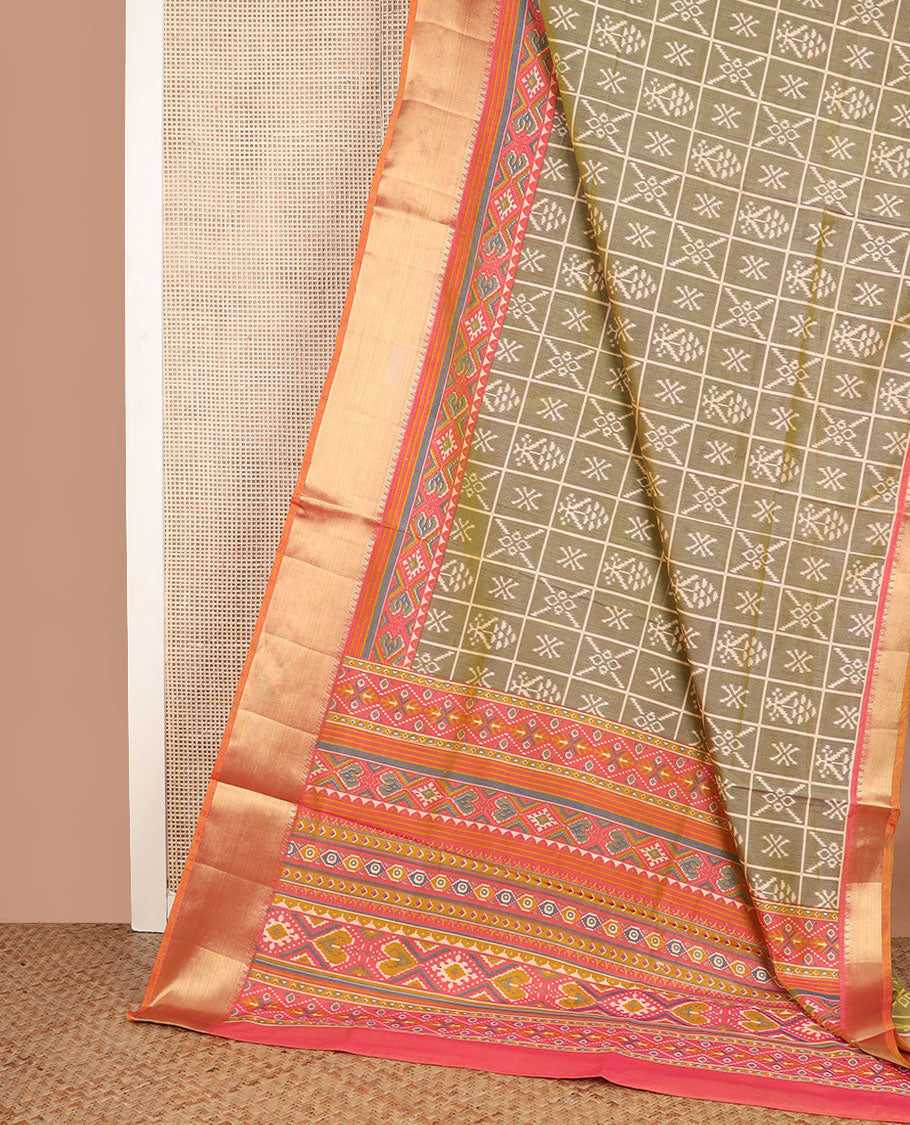 Green butta enclosed checked semi-banaras patola silk saree, contrast zari border of ikkat design, and pallu steeped with geometric patterns