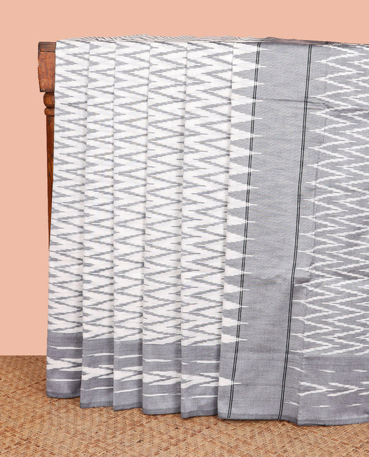 Off-White Ikkat Cotton Saree, Subtly Sparkled with Ikkat-Style Chevron Stripes All Over Its Body, Complemented by a Contrast Border, Pallu Mirrors the Same Design in Ikkat Weave, and No Blouse