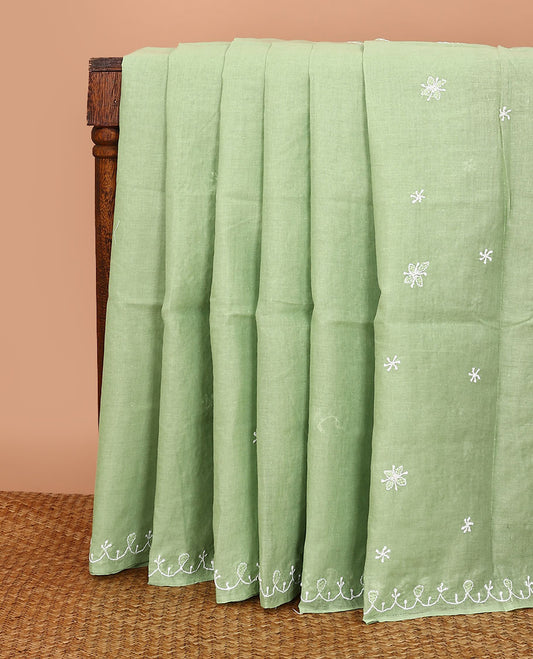 Elaichi green embroidered buttas Lucknowi chikankari saree, thread embroidered border, and floral-paisley motifs embroidered pallu