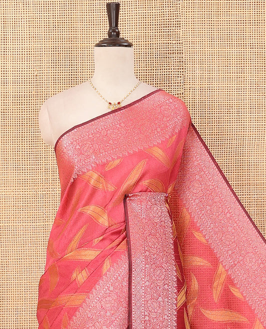 Pink leaf buttas dupion saree, traditional border of floral creeper designs, and pallu of multi-colored thread stripes