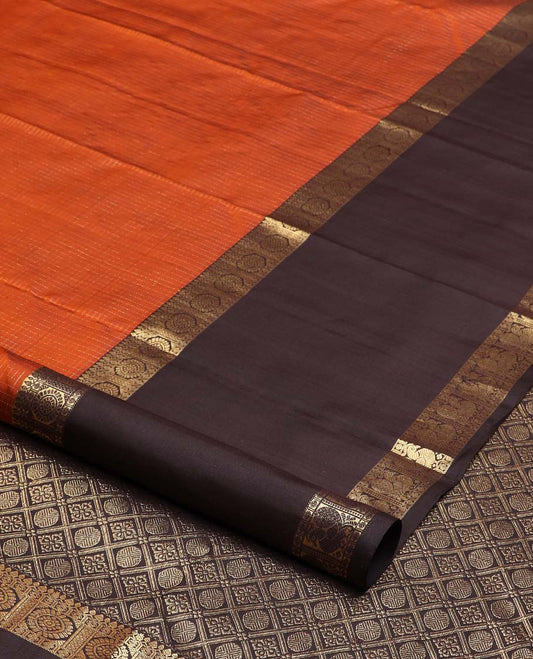 Orange micro-zari checked Kanchipuram silk saree, contrast rettai pettu border of thilakam mokku, rudraksham, and poo chakram and mayil designs, and buttas enclosed jaal pallu