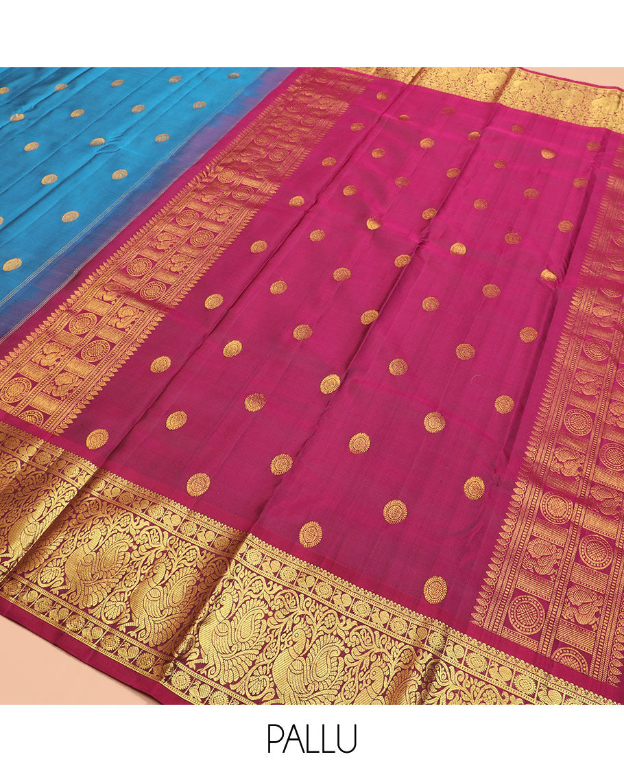 Blue chakram buttas Kanchipuram silk saree, contrast border of mayil chakram designs, and pallu steeped with chakram motifs