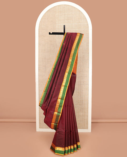 Maroon Kanchipuram Silk Saree Depicting All-Over Stripes and Manga Buttas, Complemented with Contrast Manga and Kathir Design Rettai Pettu Border, Pallu of Zari Designs, and Paired with a Contrast Blouse