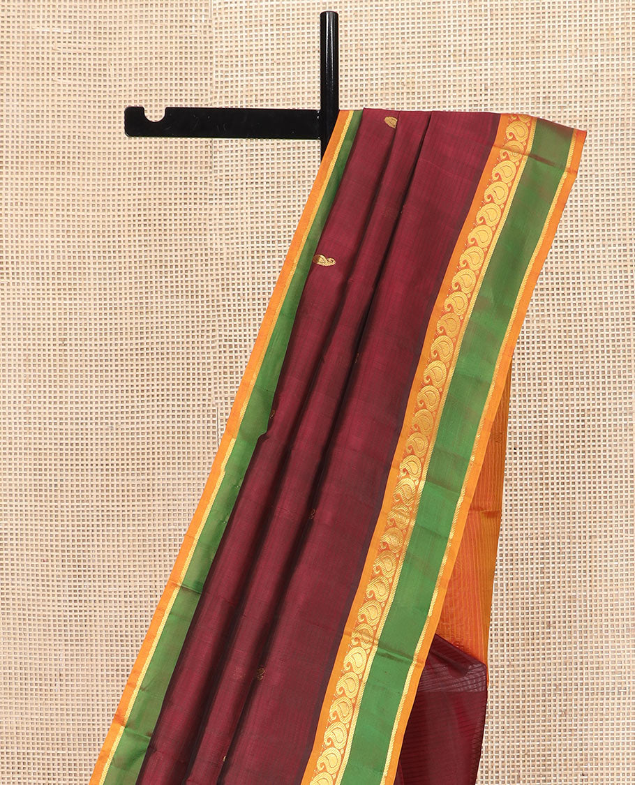Maroon Kanchipuram Silk Saree Depicting All-Over Stripes and Manga Buttas, Complemented with Contrast Manga and Kathir Design Rettai Pettu Border, Pallu of Zari Designs, and Paired with a Contrast Blouse