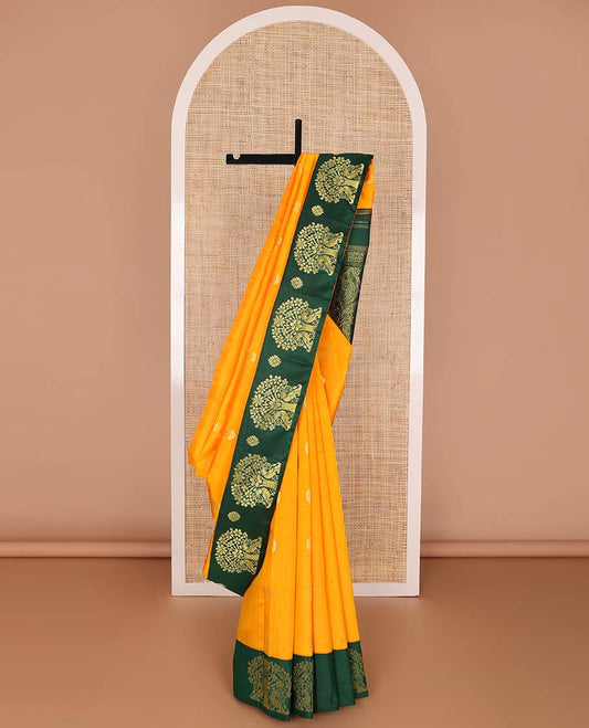 Orange chakram zari buttas kancheepuram silk saree, contrast one-sided korvai border features peacock & tree of life design & pallu steeped with mayil motifs