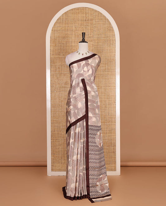 Beige geometric patterns printed Turkey crepe saree, contrast printed piping border, printed pallu, and printed blouse