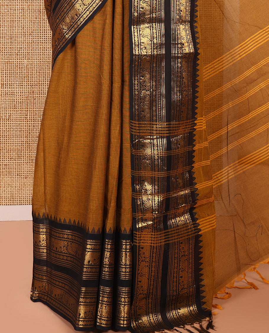 Mustard Plain Chettinad Cotton Saree, Complemented by a Contrast Temple Rettai Pettu Border Featuring Elephant, and Peacock Motifs, Subtly Striped Pallu, and Paired with a Matching Blouse