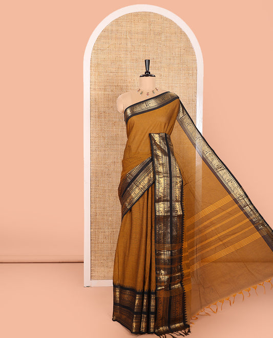 Mustard Plain Chettinad Cotton Saree, Complemented by a Contrast Temple Rettai Pettu Border Featuring Elephant, and Peacock Motifs, Subtly Striped Pallu, and Paired with a Matching Blouse