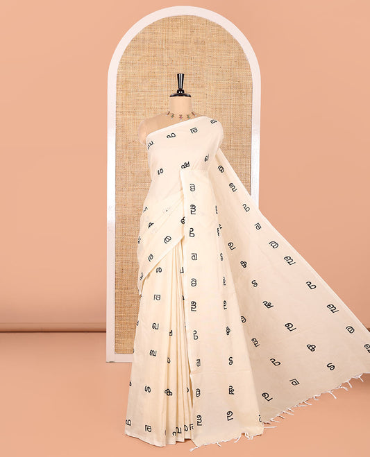 Borderless Cream South Cotton Saree, Accentuated with Malayalam Letter Motifs Printed All Over Its Body, Pallu Mirrors the Same Print, and Paired with a One Matching Blouse, and One Contrast Printed Blouse