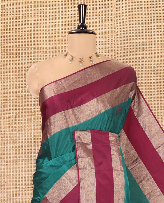 Green Soft Silk Saree, Adorned with Rudraksham Motifs All Over Its Body, Complemented by a Contrast Rettai Pettu Border, Pallu Pictures a Big Circle, and Paired with a Matching Blouse