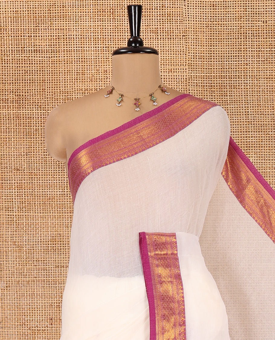 Cream Plain Khadi Mul Cotton Saree, Complemented by Contrast Traditional Zari Design Border, a Self-Pallu, and Has a Matching Blouse