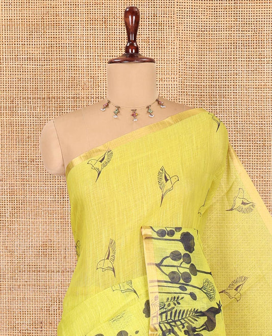 Lemon Yellow Linen Cotton Saree, Accentuated with Flora-Fauna Print, a Piping Border, Printed Pallu and a Contrast Blouse