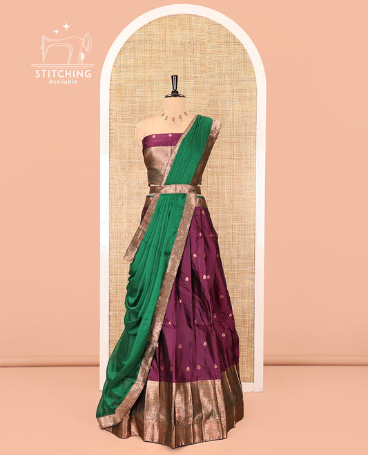 Dark Magenta-Green Semi-Banarasi Half-Saree Features Buttas Skirt,Contrast Traditional Zari Border, a Matching Blouse, and a Contrast Satin Georgette Dhavani