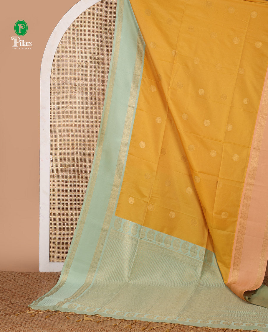 Yellow chakra buttas semi-soft silksaree,contrast ganga jamuna rettai pettu traditional border & pallu of paisley & stripes