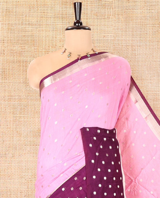 Pink Assam Silk Saree, Masterfully Woven with Zari Buttas on Its Body, Complemented by Contrast Border Steeped with Zari Buttas, Pallu Steeped with Gleaming Zari Stripes and Buttas, and Paired with a Contrast Blouse