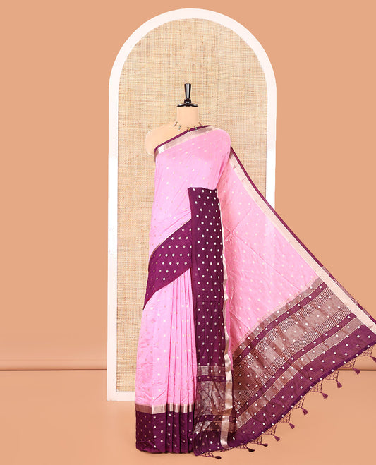 Pink Assam Silk Saree, Masterfully Woven with Zari Buttas on Its Body, Complemented by Contrast Border Steeped with Zari Buttas, Pallu Steeped with Gleaming Zari Stripes and Buttas, and Paired with a Contrast Blouse