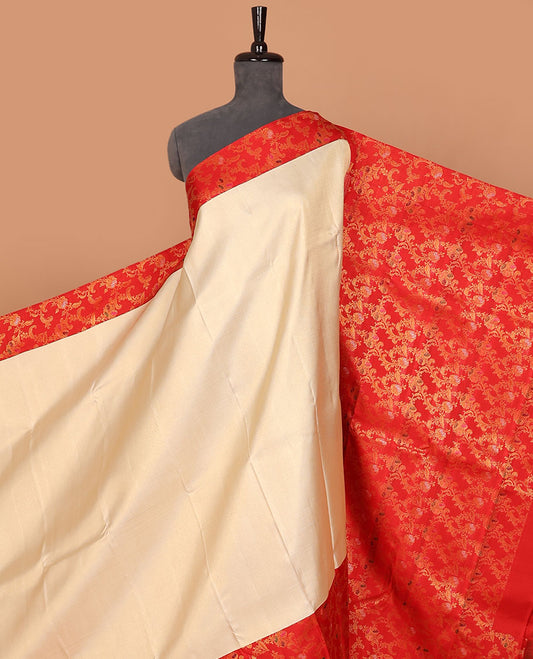 Cream embossed silk saree, contrast red border & pallu features meenakari resham thread woven floral jaal design