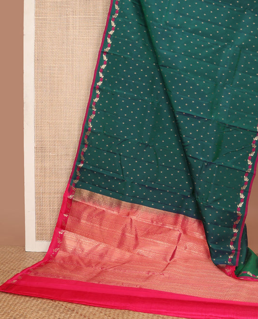 Green vasundhara elite saree with zari buttas, contrast floral creeper border & pallu steeped with banaras,vanki & then kuli kann