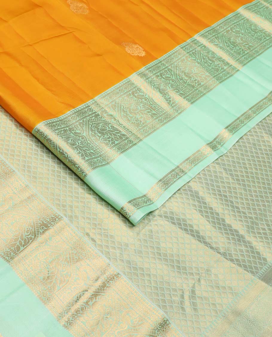 Orange zari buttas Vasundhara silk mix saree, contrast border rettai pettu of mayil designs, and jaal pallu