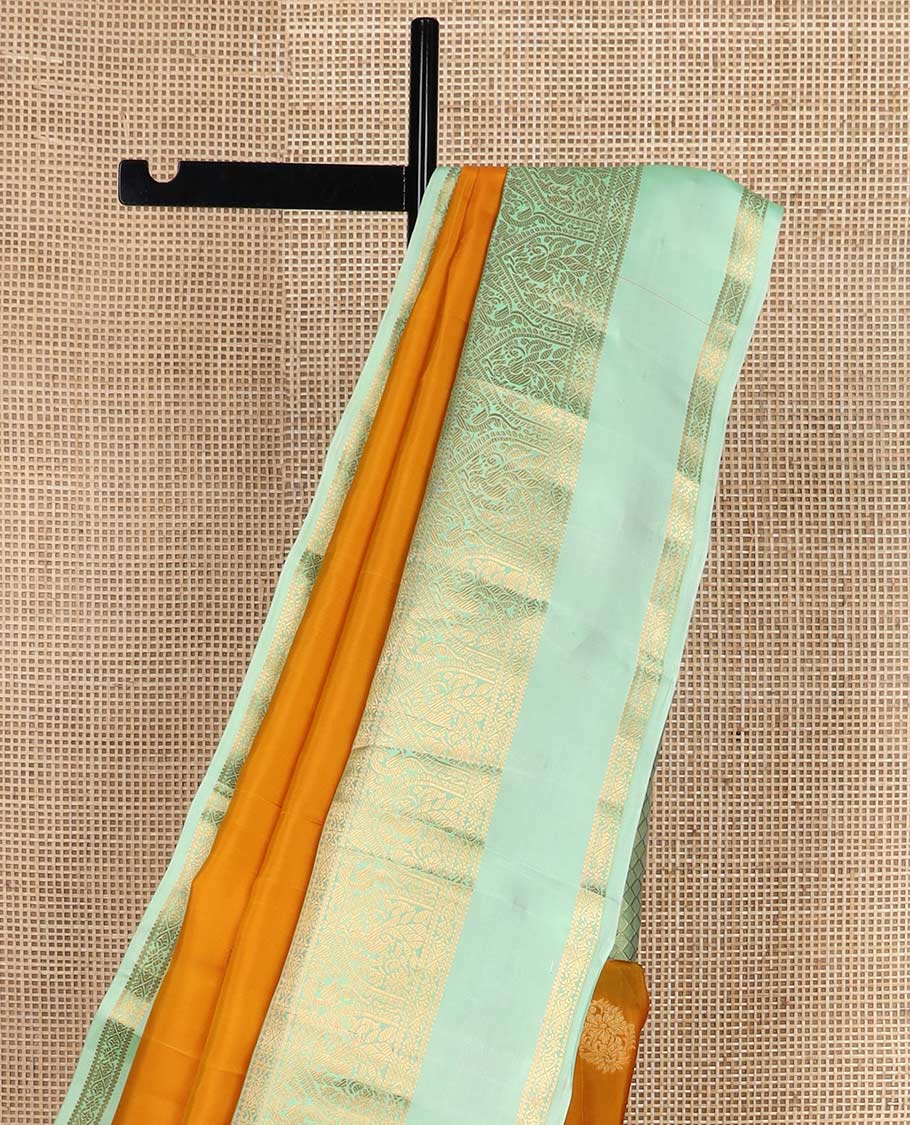 Orange zari buttas Vasundhara silk mix saree, contrast border rettai pettu of mayil designs, and jaal pallu