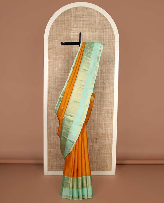 Orange zari buttas Vasundhara silk mix saree, contrast border rettai pettu of mayil designs, and jaal pallu