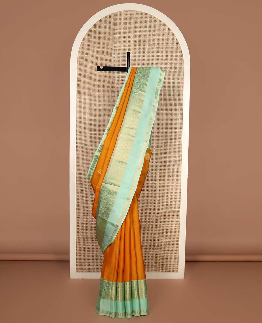 Orange zari buttas Vasundhara silk mix saree, contrast border rettai pettu of mayil designs, and jaal pallu