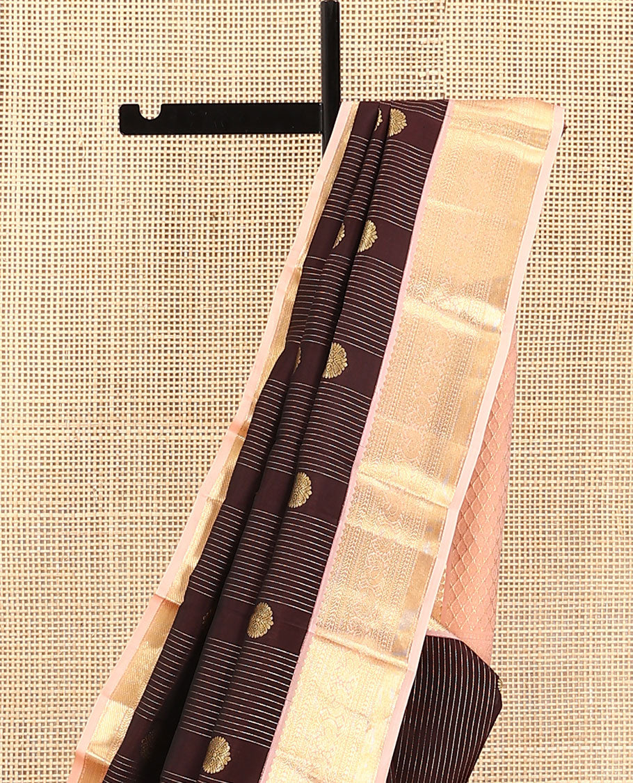 Brown Vasundhara Lite Silk Mix Saree, Prettified with Stripes, and Chakram Buttas, Complemented by a Contrast Border of Thilakam Mokku, Muthu, Banaras, Neli, and Mayil Designs, Pallu Steeped with Peacock Feather Designs, and Paired with a Contrast Blouse